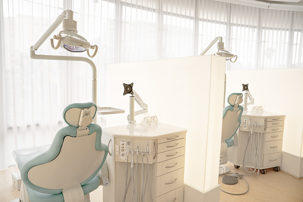 Treatment bay with a pale blue chair and equipment at Milk Orthodontics Newmarket